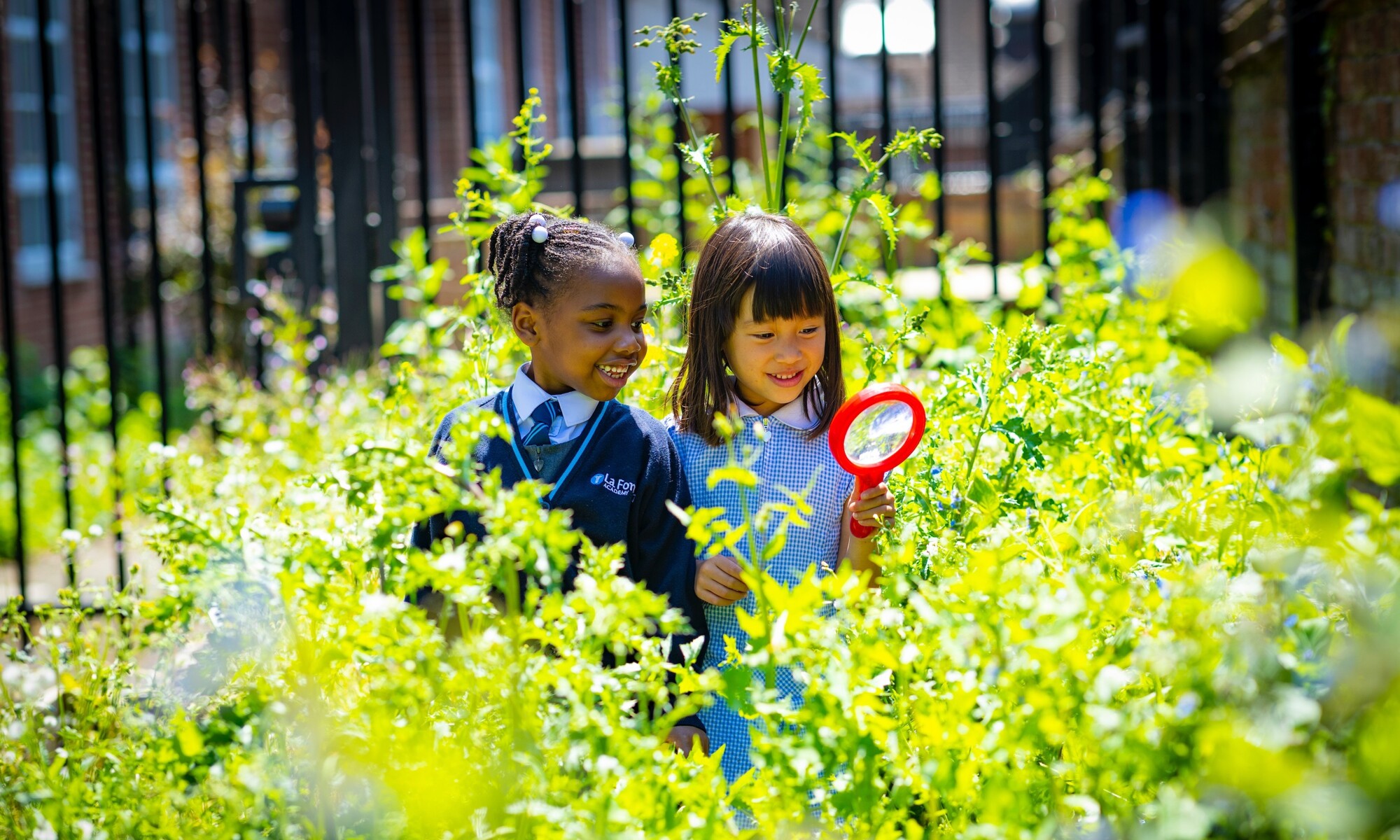 La Fontaine Academy Image of Two Pupils in the School Grounds
